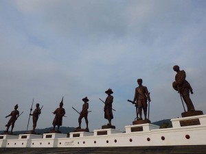 The Thai army has recently finalised the installation of seven giant statues of famed Rama kings in Ratchapakdi Park in Hua Hin district of Prachuap Khiri Khan. Each statue is cast from bronze and were transported from a factory in Bangkok by truck. The Kings represented are King Chulalongkorn, King Ramkhamhaeng the Great, King Naresuan the Great, King Narai the Great, King Taksin the Great, King Buddha Yodfa Chulalok the Great, and King Mongkut. After their installation, many artists from six casting factories in Nakhon Pathom, Lop Buri, Ayutthaya, Pathum Thani and Bangkok decorated the 13.9-metre-tall and six-metre-wide masterpieces. The statues weigh in at 30 tonne each. The Thai army has recently finalised the installation of seven giant statues of famed Rama kings in Ratchapakdi Park in Hua Hin district of Prachuap Khiri Khan. Each statue is cast from bronze and were transported from a factory in Bangkok by truck. The Kings represented are King Chulalongkorn, King Ramkhamhaeng the Great, King Naresuan the Great, King Narai the Great, King Taksin the Great, King Buddha Yodfa Chulalok the Great, and King Mongkut. After their installation, many artists from six casting factories in Nakhon Pathom, Lop Buri, Ayutthaya, Pathum Thani and Bangkok decorated the 13.9-metre-tall and six-metre-wide masterpieces. The park is intended to demonstrate people's loyalty to the royal institution in Thailand which it does with overwhelming style and class. Their installation happened between July 27 and Aug 9 2015 with a ceremonial blessing which was received by an audience estimated at approximately 10,000 people. The ceremony, chaired by Prime Minister Prayut Chan-o-cha, was performed by 108 revered monks from across the country. The park is intended to demonstrate people's loyalty to the royal institution in Thailand which it does with overwhelming style and class. If you are visiting, try and attend in the morning for the best photo opportunities, after lunch the sun is behind the statues making it difficult to photograph the detail from the front. You are limited by the army presence as to where you can photograph the statues, being only allowed to stand on the concrete area immediately in front of stairs leading up to the base.